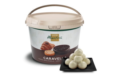 Tarrina grande de crema para untar Master Martini Caravella junto a trufas de chocolate blanco en plato cuadrado negro.