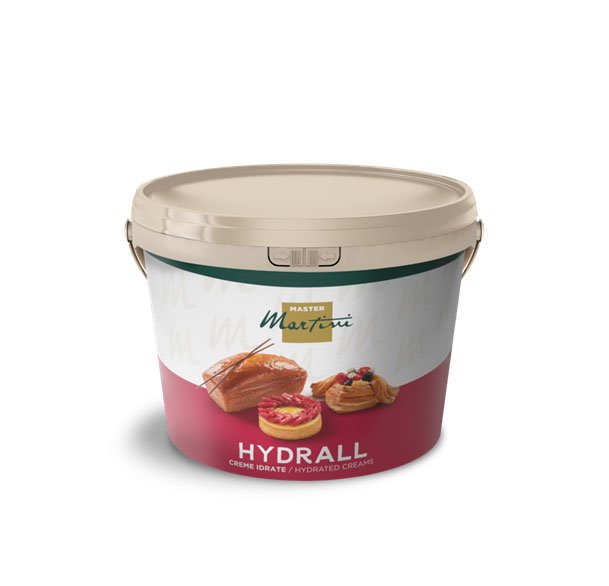 Cubo beige de cremas hidratadas Master Martini Hydrall, etiquetado con pasteles y tartas de fruta